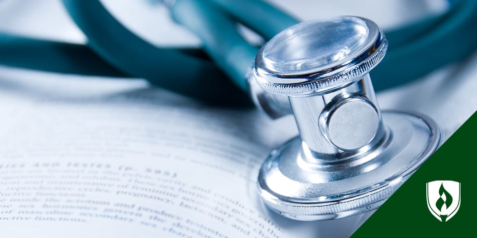 stethoscope laying on a medical book