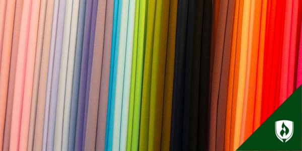Bolts of fabric in many colors arranged in a line