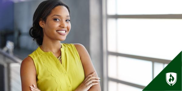 A business student smiles confidently at the camera