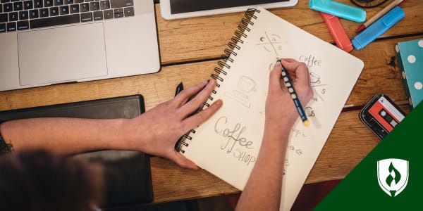 photo of a designer sketching on a notepad representing creativity exercises for designers