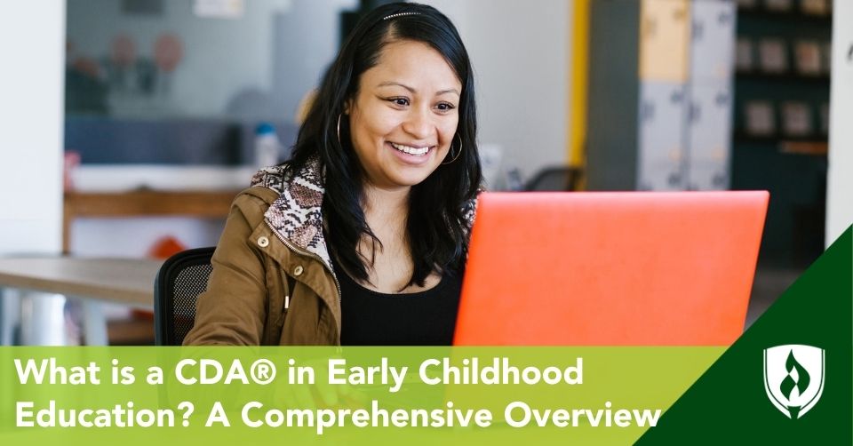 An ECE teacher works at a computer