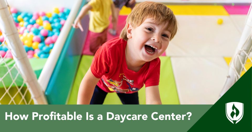 A laughing child climbs an indoor play structure