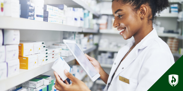 A pharmacy technician selects medication using a tablet