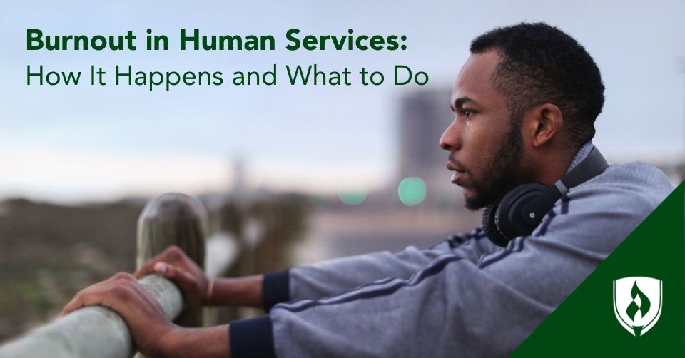 A social services assistant looks out over a field