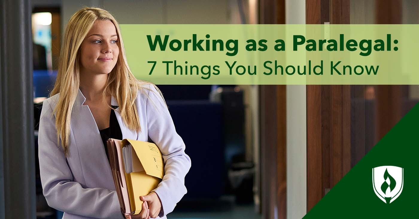 photo of a paralegal holding a stack of files representing working as a paralegal