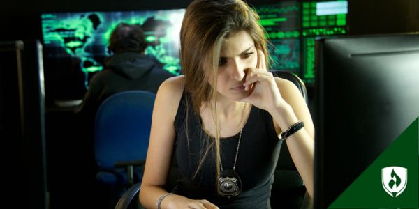 A detective sits in front of her computer