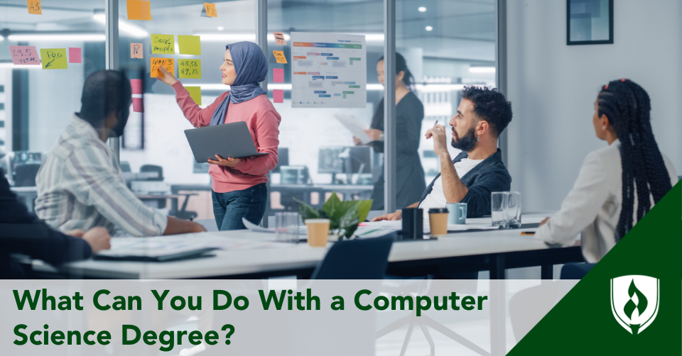 A computer science degree holder leads a presentation in her office