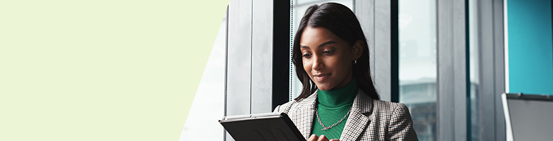 Business professional working on a tablet in an office building