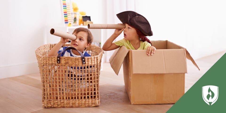 photo of two preschoolers pretending to be pirates representing dramatic play