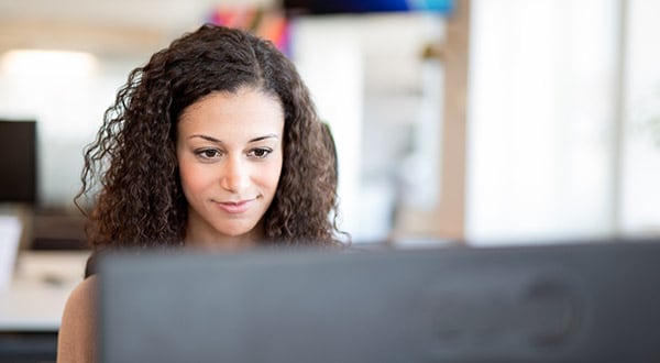 Female working at computer MBC