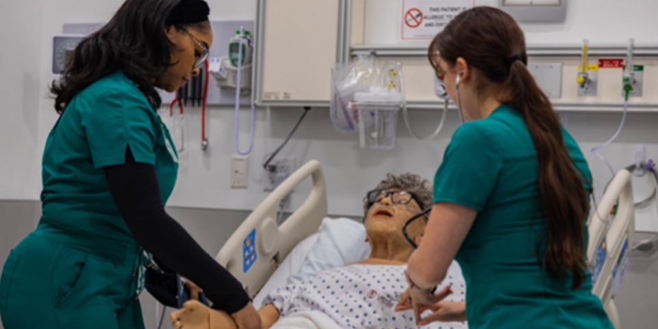 Students utilizing simulators at the Health Sciences lab at the Rasmussen University Central Florida college, Pasco campus location.