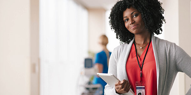 female nurse holding papers